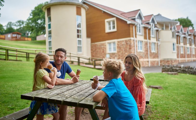 Family sat outside the Wookey Hole Hotel